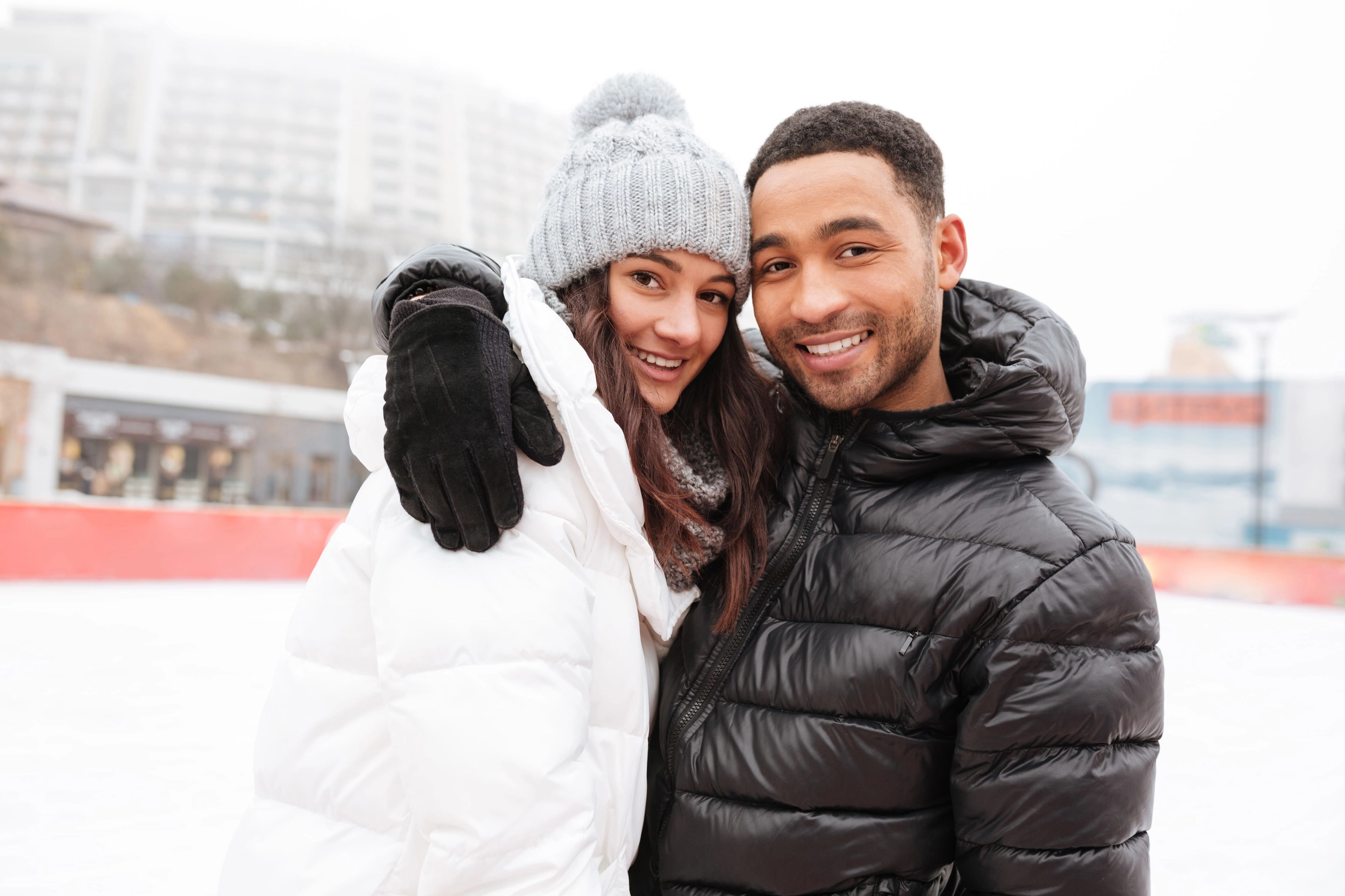 attractive-loving-couple-skating-ice-rink-outdoors
