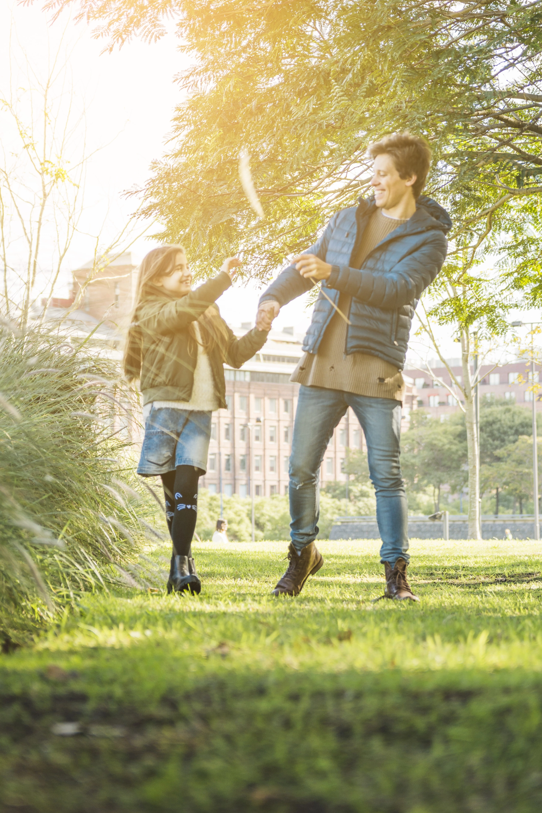 happy-father-daughter-playing-with-reed-park