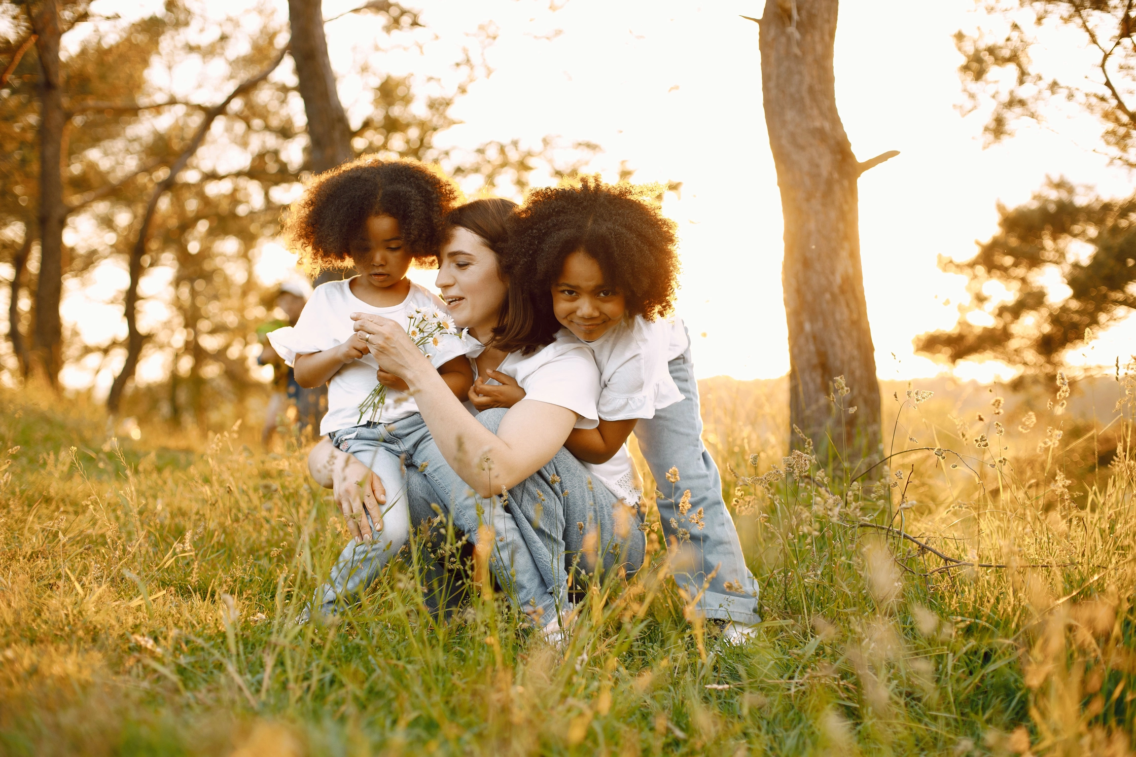 photo-caucasian-mother-two-her-african-american-daughters-embracing-together-outdoors-girls-has-black-curly-hair