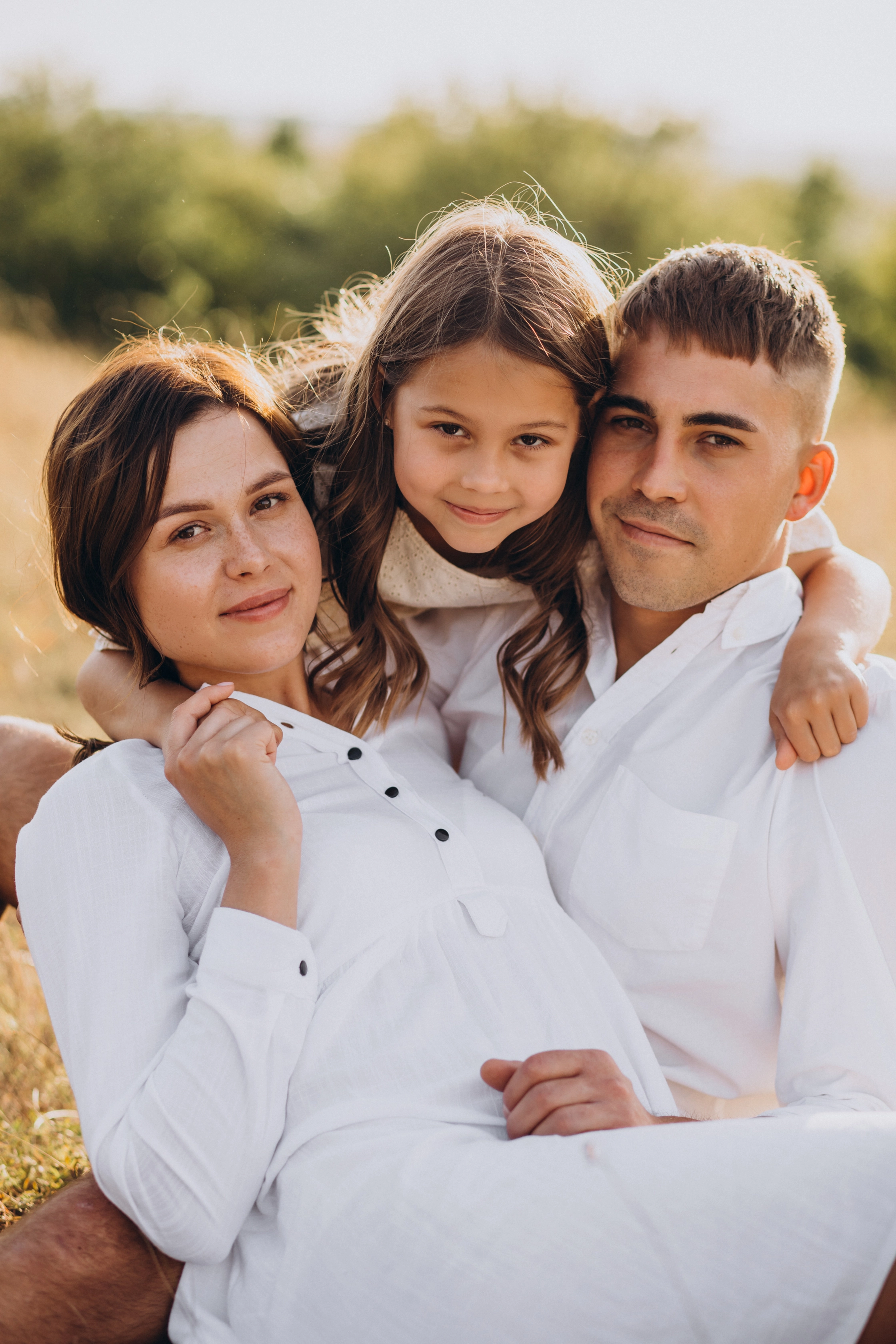 young-family-with-daughter-meadow