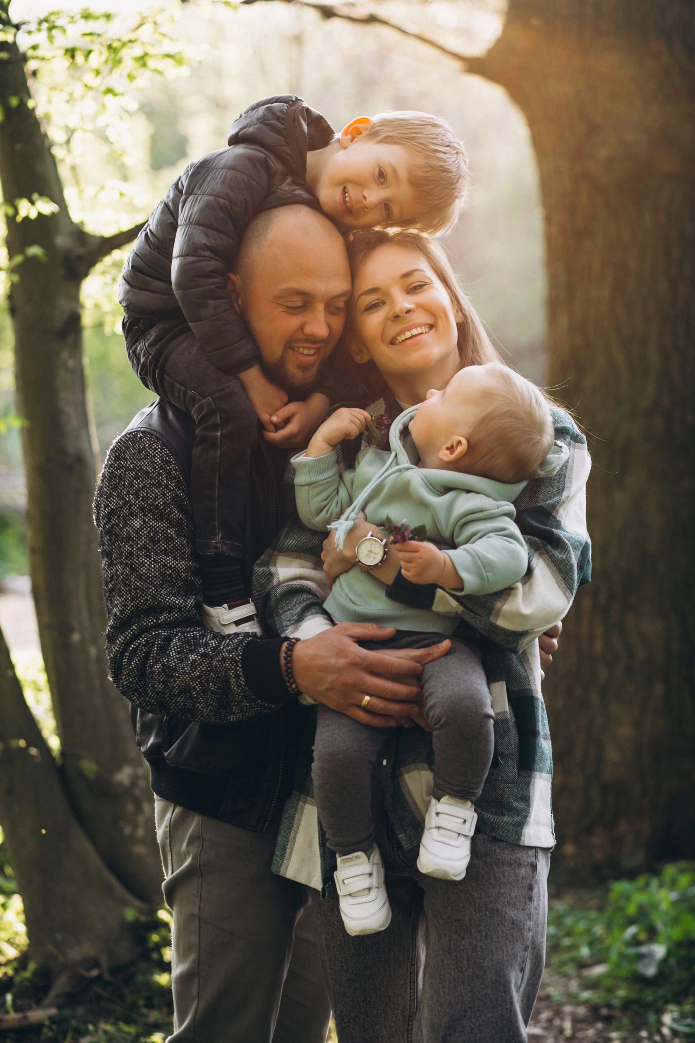 young-family-with-their-kids-having-fun-forest