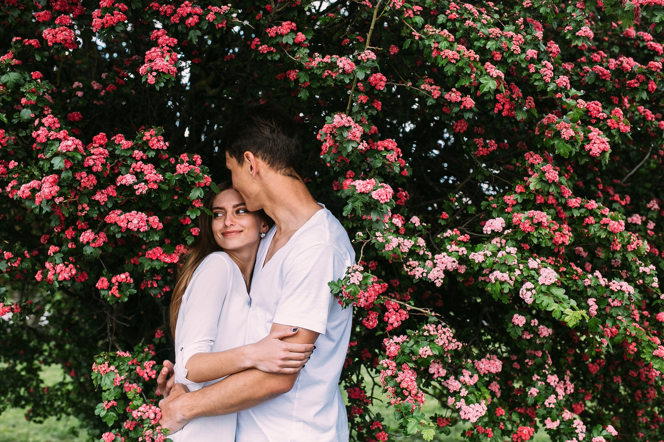 young-happy-couple-love-outdoors-loving-man-woman-walk-spring-blooming-park