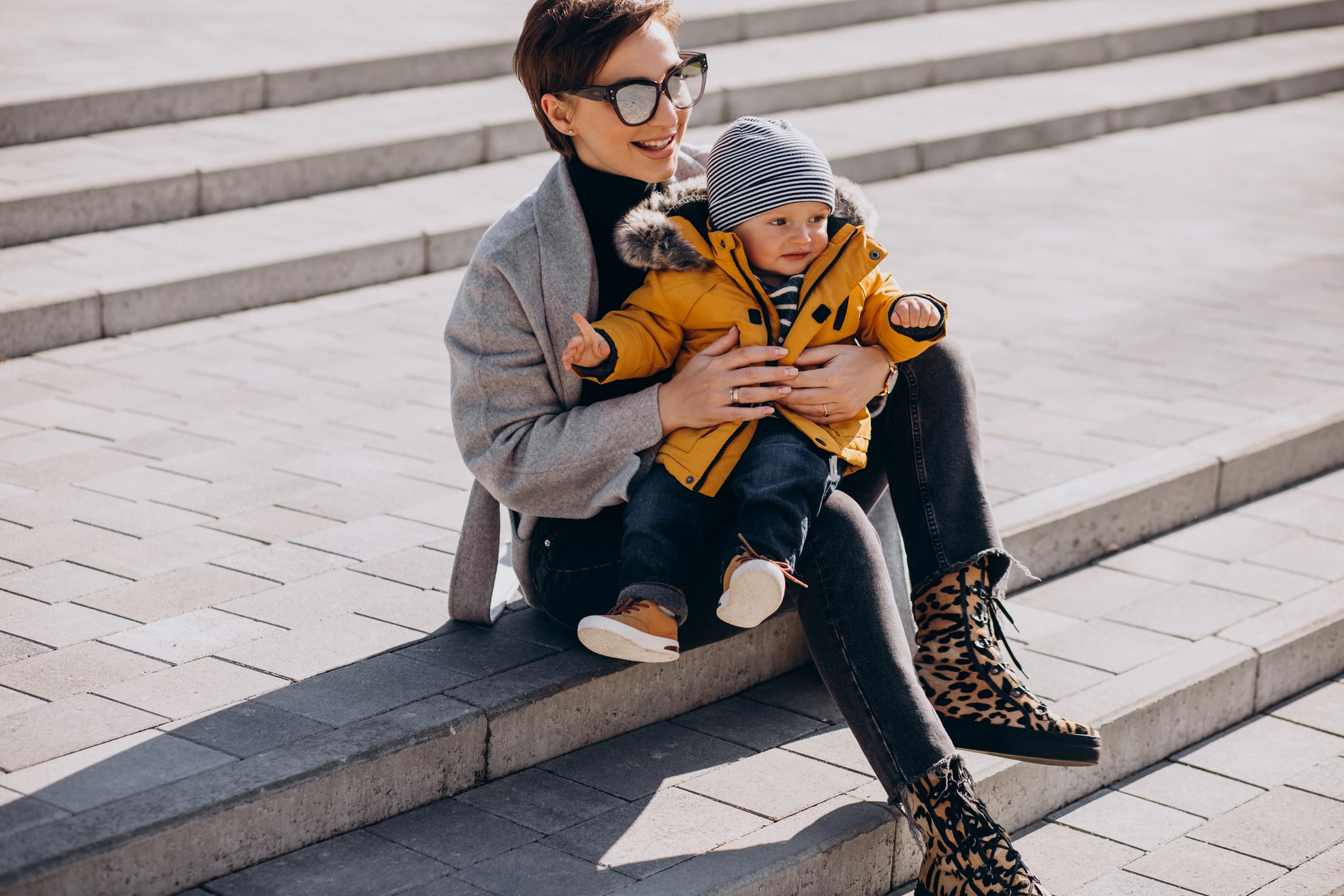 young-mother-walking-with-her-little-toddler-son-park