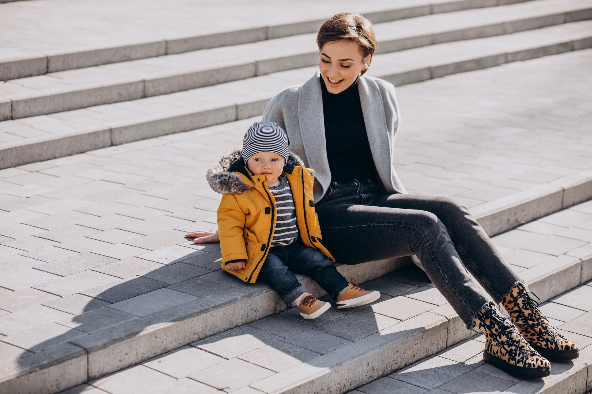 young-mother-walking-with-her-little-toddler-son-park (1)